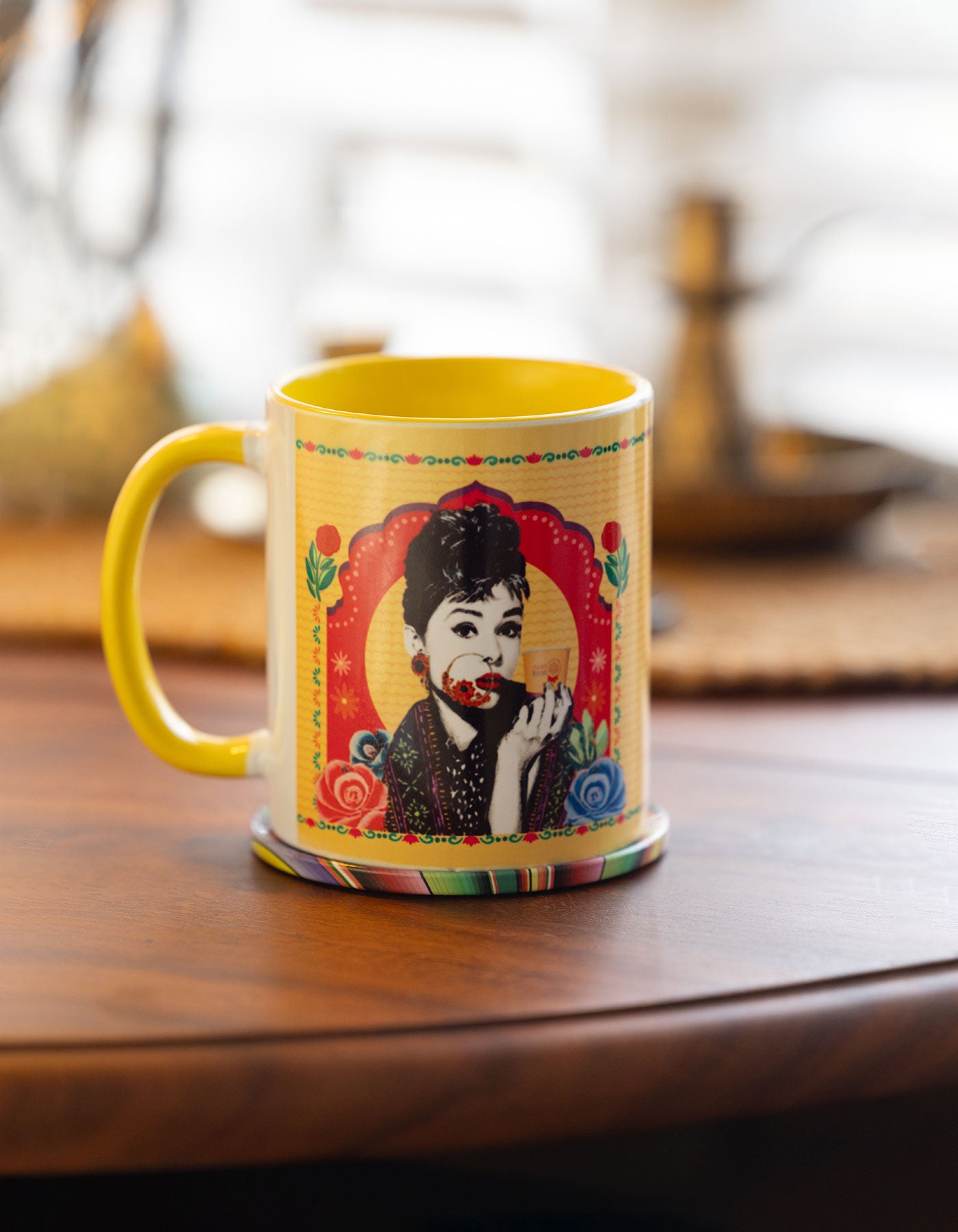 Audrey Hepburn Colorful mug with a design on a wooden surface