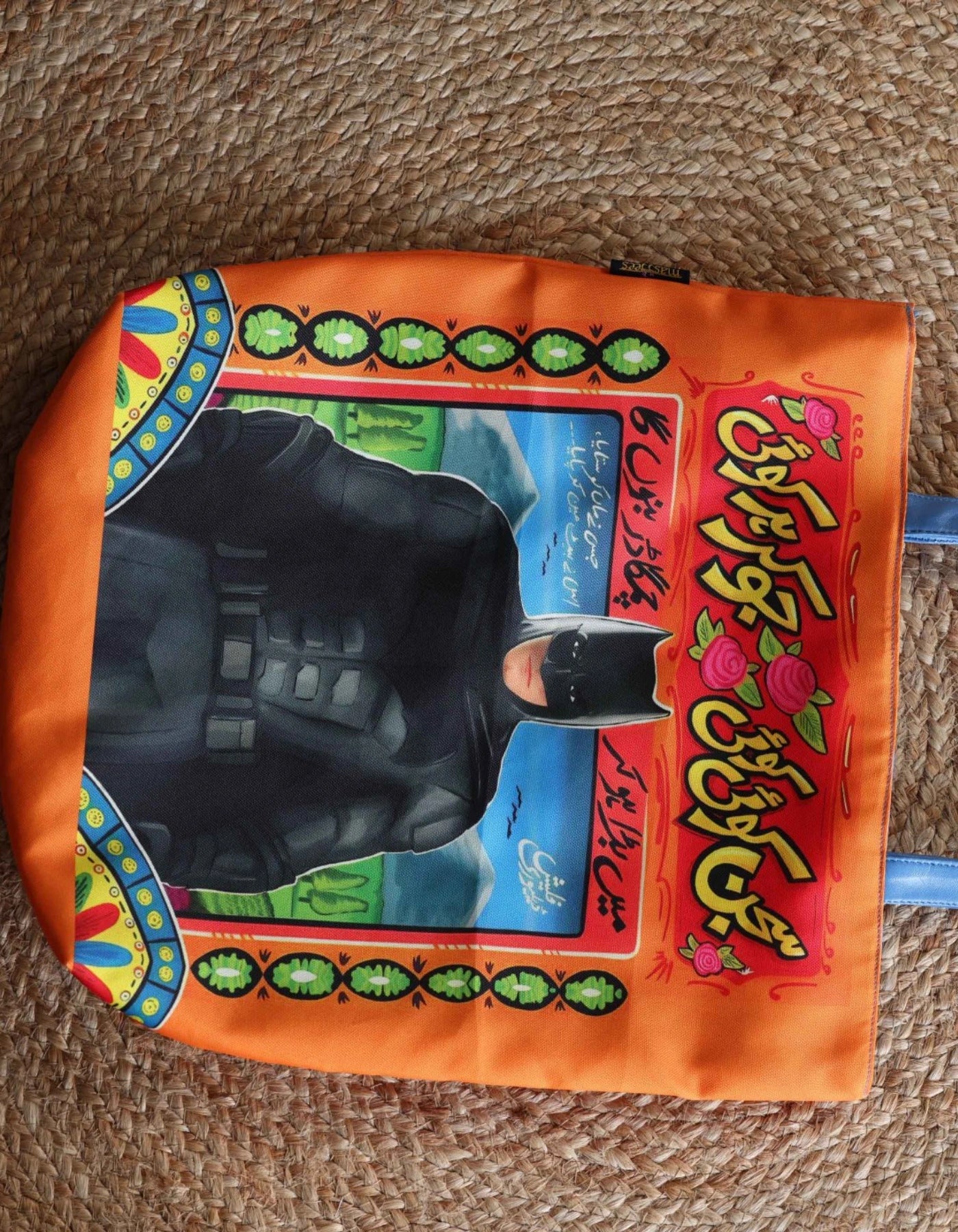 Colorful packaging with a black object on a textured surface