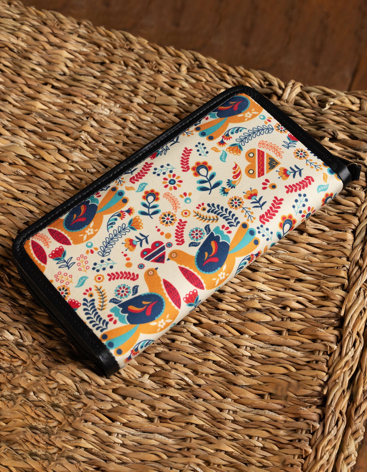 Colorful patterned pouch on a woven surface