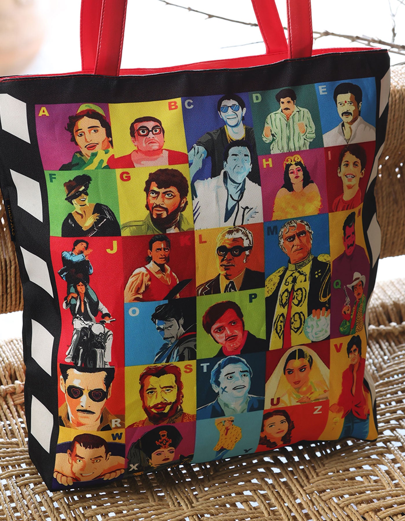 Tote bag with colorful portraits of people on a woven surface