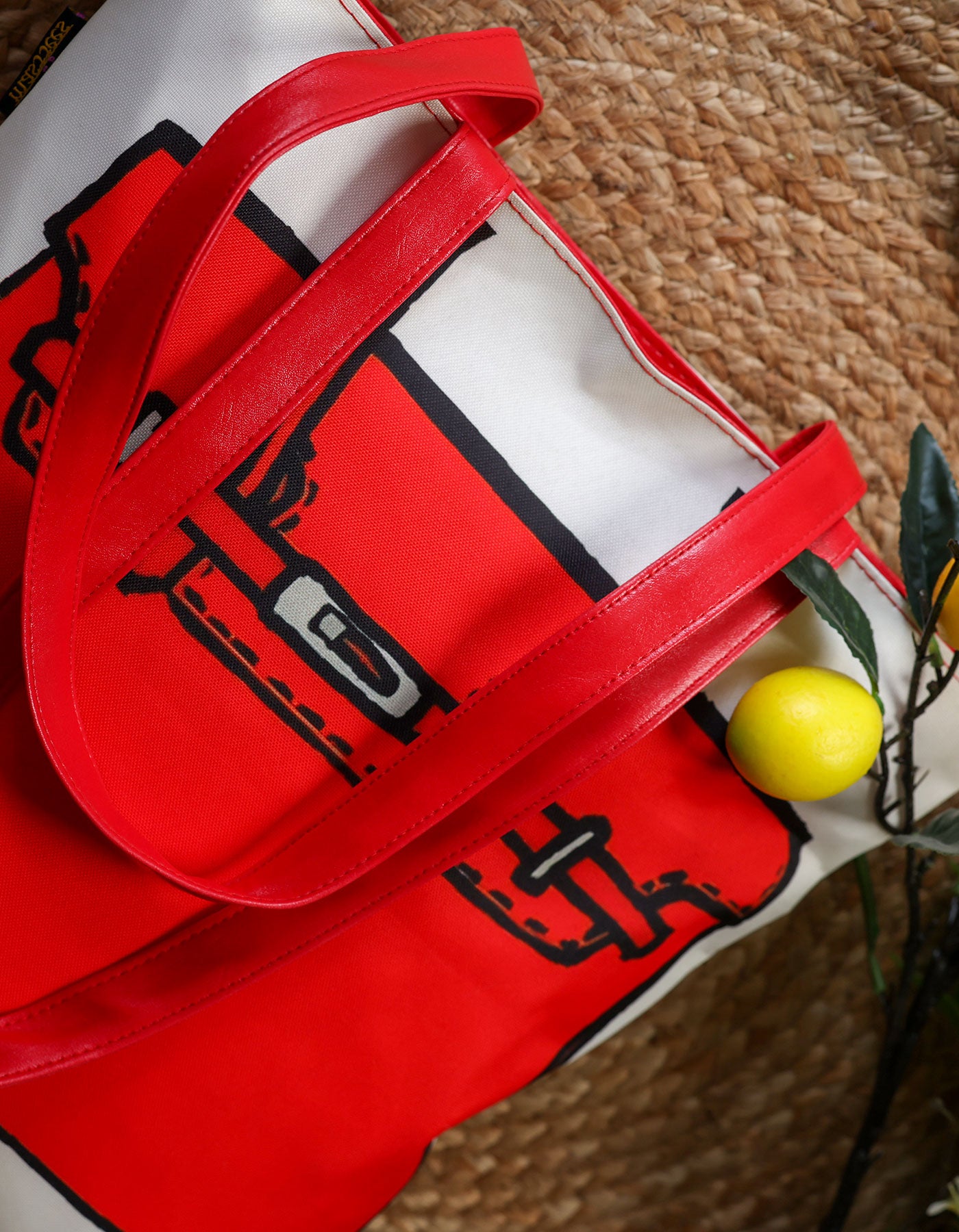 Red bag with black graphics on a textured surface
