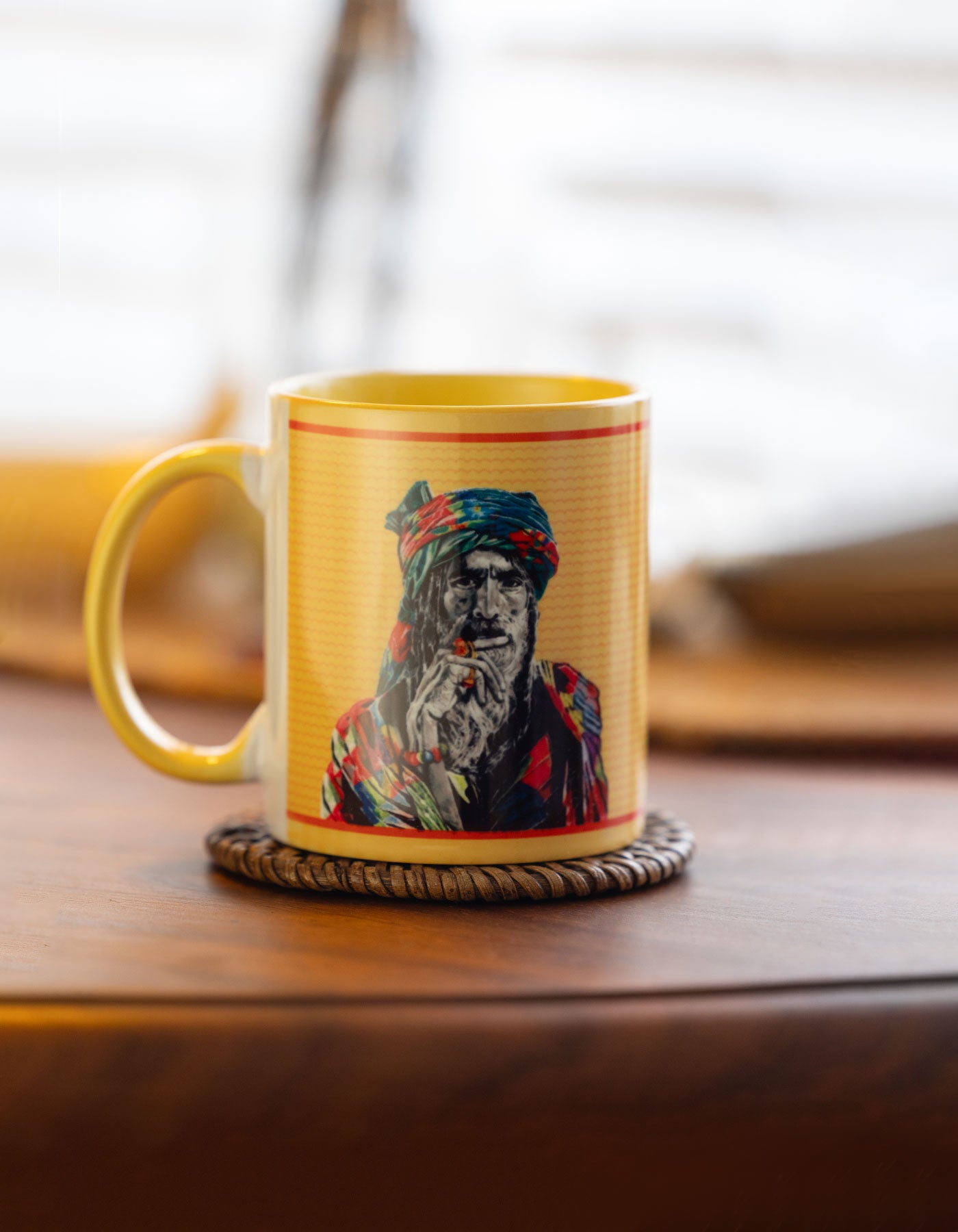 Baba Yellow mug with a colorful portrait on a wooden surface