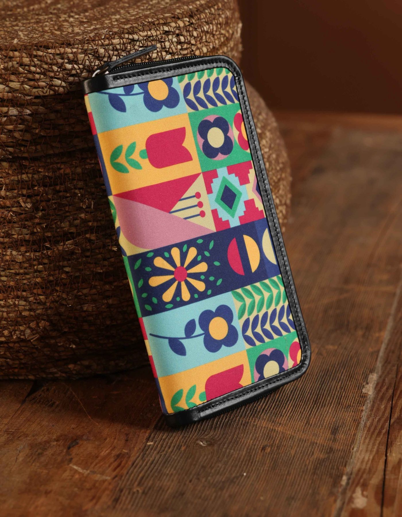 Colorful patterned wallet on a wooden surface