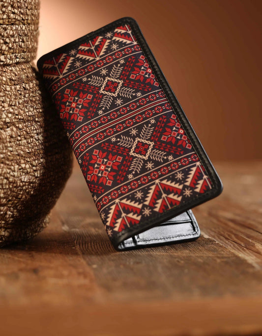 Patterned wallet on a wooden surface with a blurred background