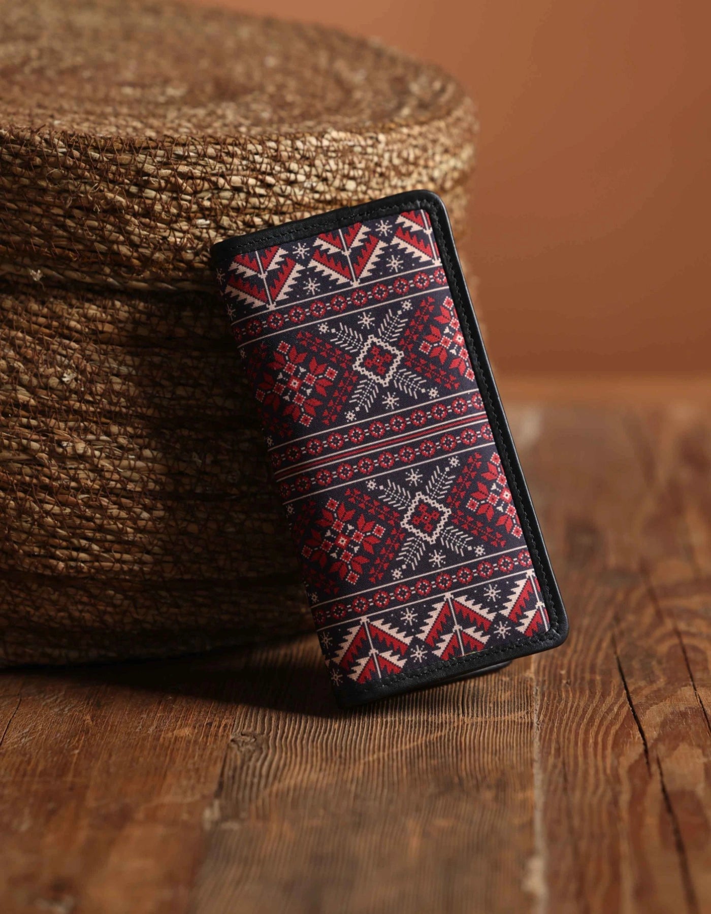 Phone case with geometric pattern on a wooden surface