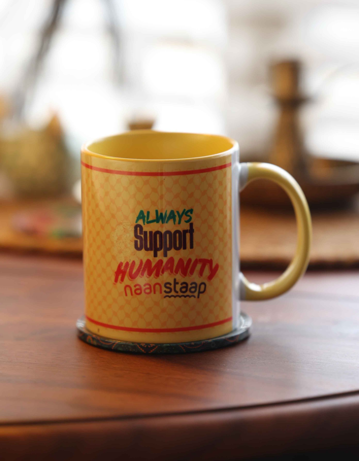 Palestine solidarity ceramic mug with "Always Support Humanity" text on a wooden surface – Masttees x Naanstaap