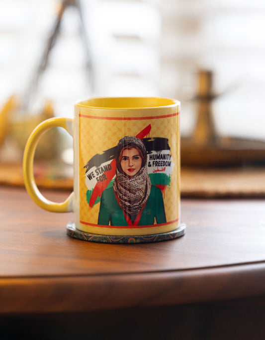 we stand for humanity and freedom palestine Mug with a graphic design on a wooden surface
